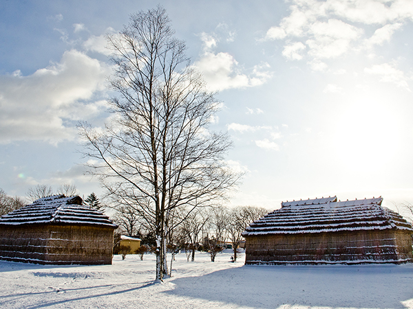 Ainu houses in Hokkaido lightly dusted with snow